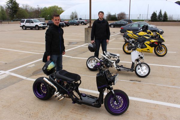 Corey Brown, left, and Paul Halverson and their Honda Ruckus scooters. 