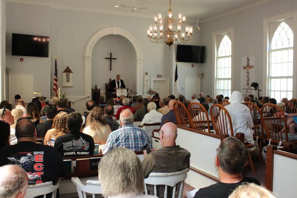 Rev. Steven Darr welcomes mourners