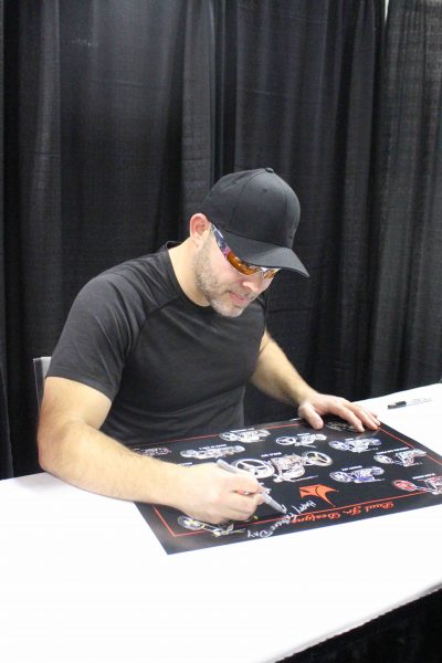 Paul Teutel Jr. signs an autograph